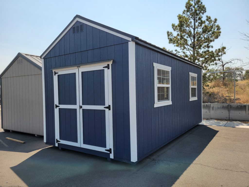 Blue shed with white trim