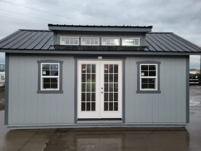 A 12x20 NorthWest Classic Shed with a black door.